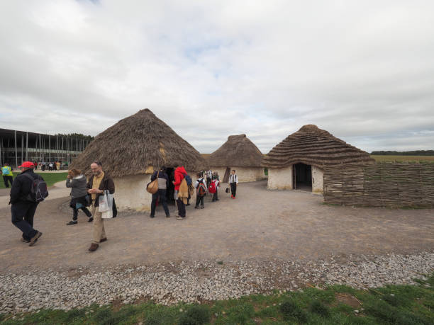 Typical African Hut in the Transkei being repaired and repainted. The green color is unique to this region and is made on site by the women who undertake the renovation. Here female members of a family pose outside. The hut shows drying of the dye from left to right with bare unpainted section on the right.Here are more images.