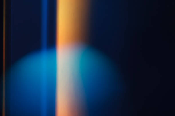 Colorful light leak on black background, abstract design with optical lens flare shot on a long lens.