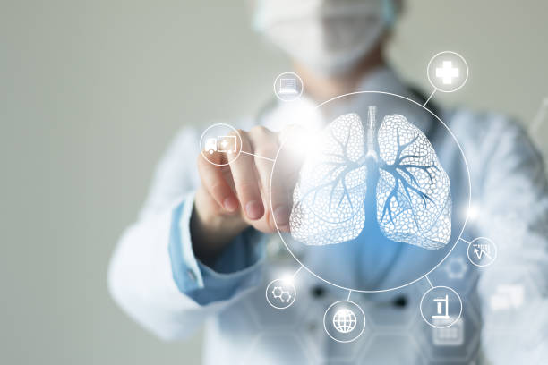 Unrecognizable female doctor holding graphic virtual visualization model of Lungs organ in hands. Multiple virtual medical icons. stock photo