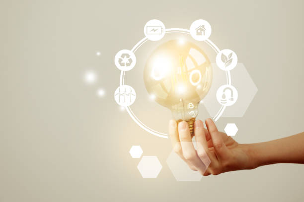 istock Woman`s hand holding glowing light bulb with energy resources icons. Ecological friendly and sustainable environment concept. 1397377303