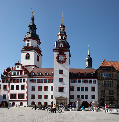Chemnitz (Saxony) old medieval town hall with new market fountain (Panorama). People relax on a sunny Sunday in May.