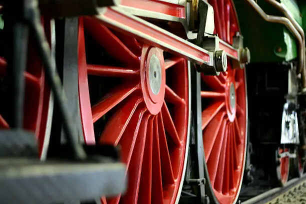 Big red wheels of an old steamengine, softfocus to make it more dramatic