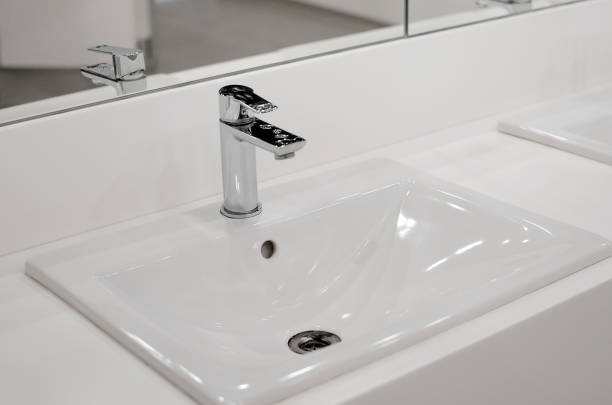 istock modern and clean bathroom sink and toiletries. Close-up, selective focus. 1397379899
