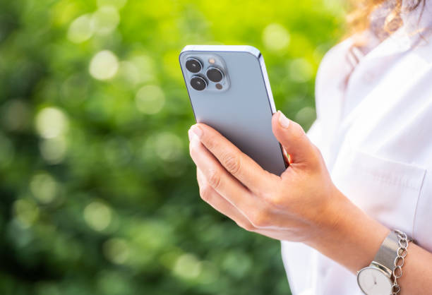 Hand holding a smartphone, close up