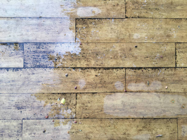 istock Water drops on a wooden floor surface after a rain with copy space. Decor and background Concept. 1397384495