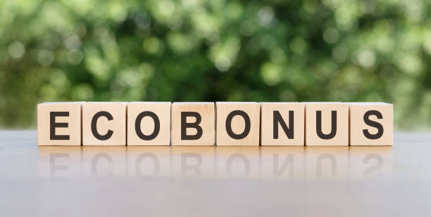 istock ECOBONUS word written on wooden cubes on blurred nature background. 1397384711