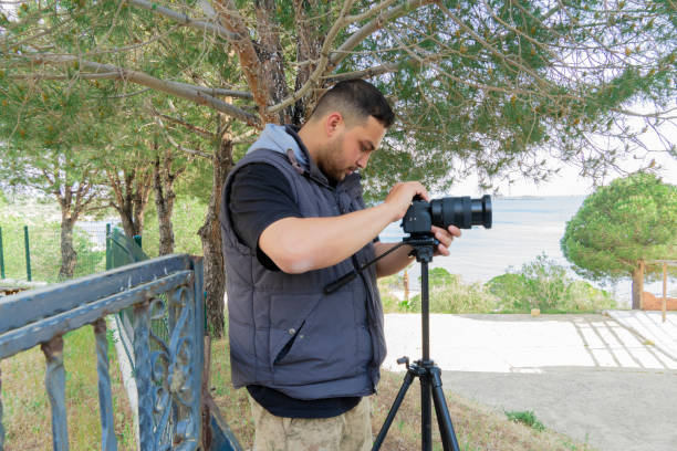 istock Photographer man taking pictures 1397384789