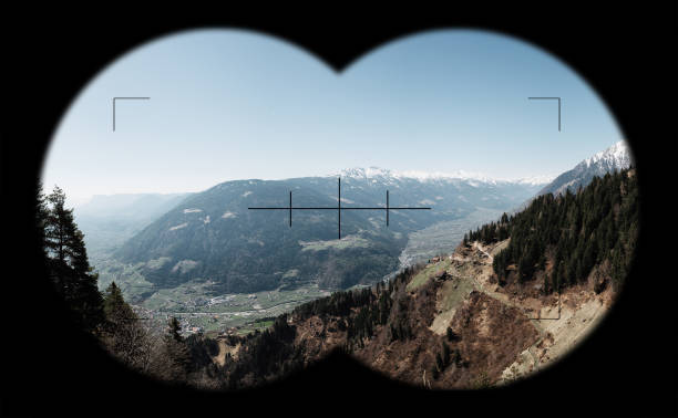 View at Mountains, alps through field glasses, binoculars. South Tyrol near Meran, in Vinschgau stock photo