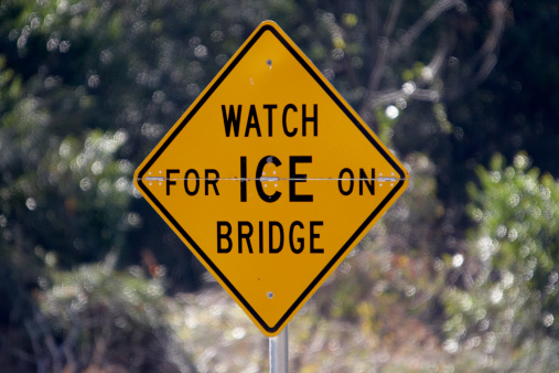 Sign warning that there may be ice on the bridge ahead