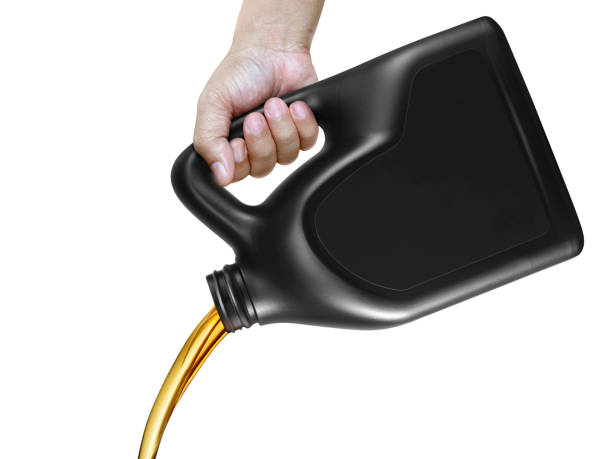 istock Engine oil pouring from a canister in hand isolated on white background 1397389430