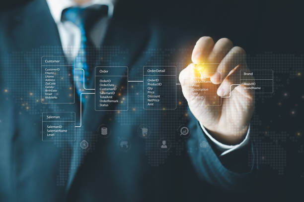 istock System analyst or businessman drawing relational database tables. Concept of database diagram design. 1397390395