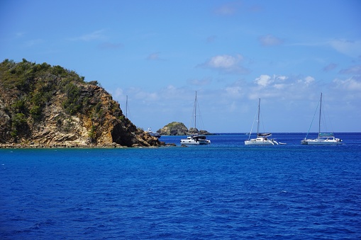 Boats moored at The Caves of Norman Island for snorkelling