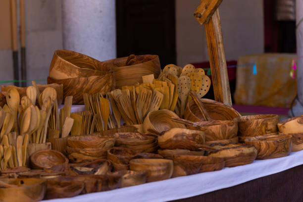 istock Beautiful handmade wooden tableware exhibited at a craft fair. 1397391327