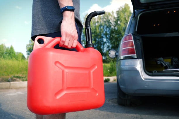 istock A red plastic gas canister. The man is going to refuel the car 1397391499