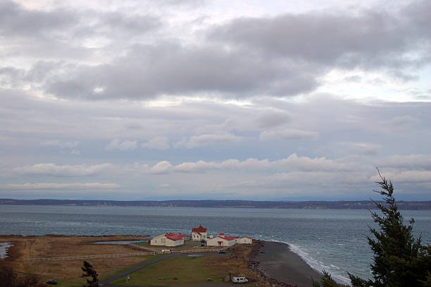 stormy afternoon a stormy afternoon at Fort Flagler State Park, a World War One era military fort that guarded the  enterance to the Puget Sound in Washington State, USA north pacific ocean globe stock pictures, royalty-free photos & images