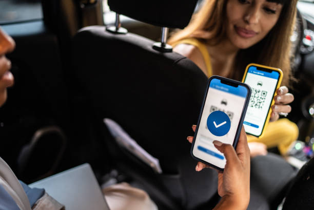 istock Woman paying a cab driver using contactless payment on smartphone 1397393237