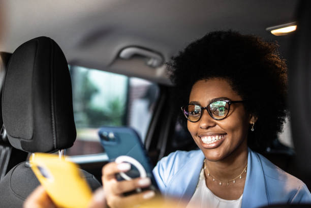 istock Woman paying a cab driver using contactless payment on smartphone 1397393371