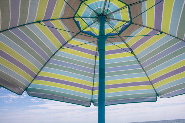 istock Summer holiday shade casting open beach umbrella 1397393998