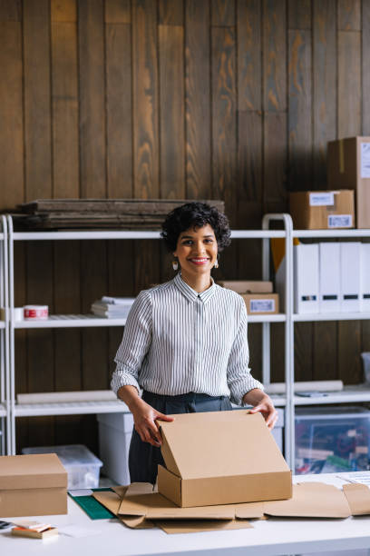 istock A Smart Businesswoman Looking At Camera While Preparing Packages For Shipping 1397394612