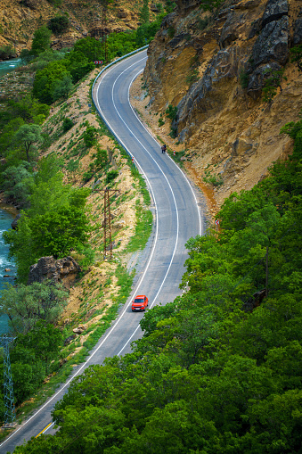 Red car on the curvy road