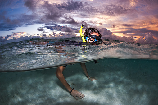 Snorkelling at Sunset in the cristal clear waters of Maldives