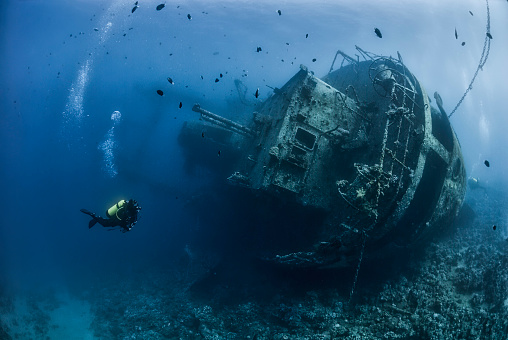 Divers exploring the shipwreck “Cedar Pride”in the Jordan Red Sea