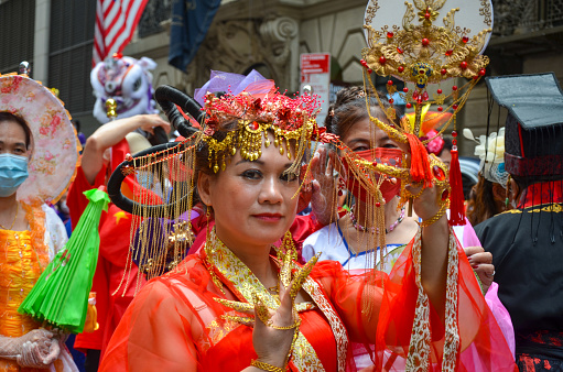 Participant is seen wearing Malaysian costume, marches down on Sixth Avenue during the first ever Asian American and Pacific Islander Cultural and Heritage Parade in New York City on May 15, 2022.