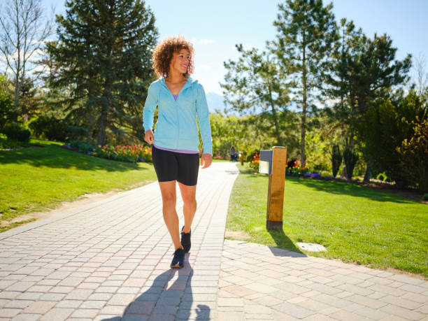 Woman Walking in a Park