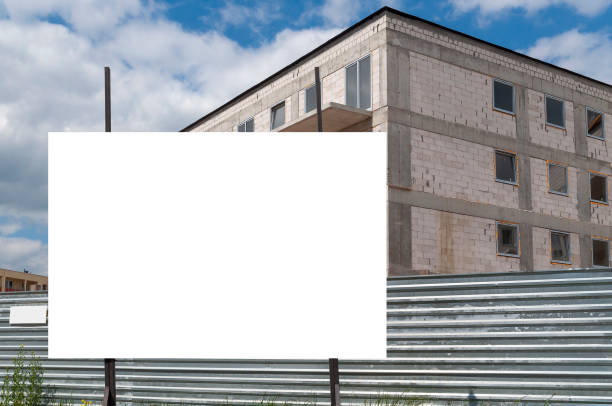 istock Blank white billboard for advertisement in front of the construction site 1397401345