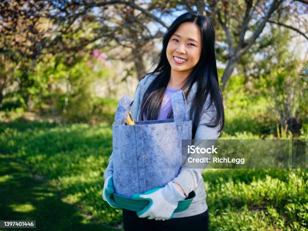 Woman Gardening Outdoors Stock Photo - Download Image Now - 35-39 Years, Active Lifestyle, Adult