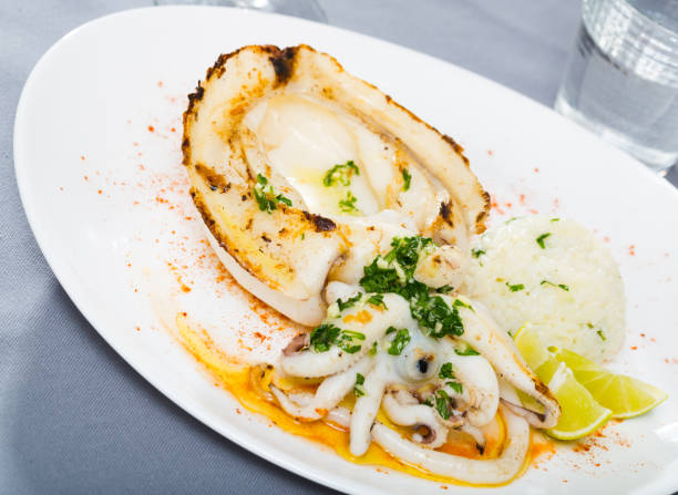 istock Baked in oven cuttlefish, rice, lemon 1397402247