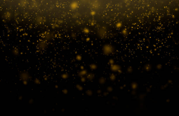 istock Golden dust particles defocused lights on an abstract background. 1397404627