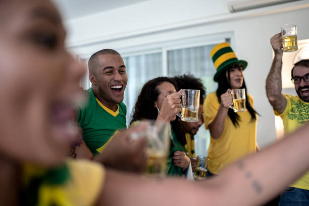 istock Friends celebrating a goal while watching a soccer match at home 1397407054