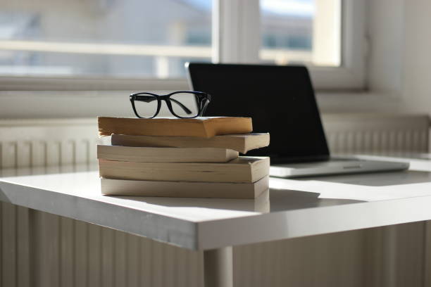 istock Cup of coffee and laptop on the table. 1397408119