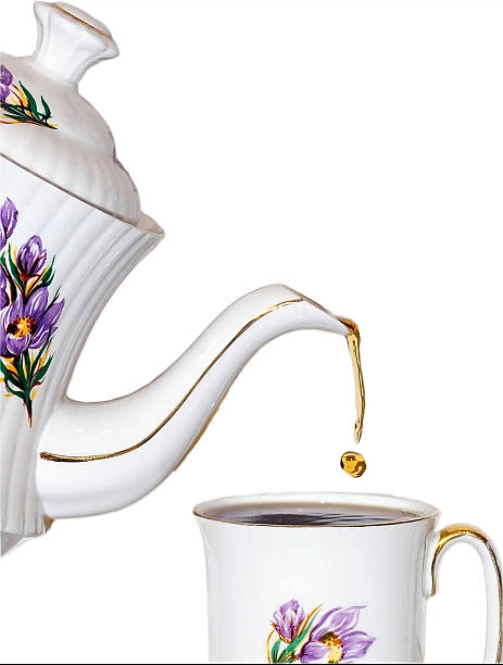 istock Tea being poured into a cup from a matching teapot 139740881