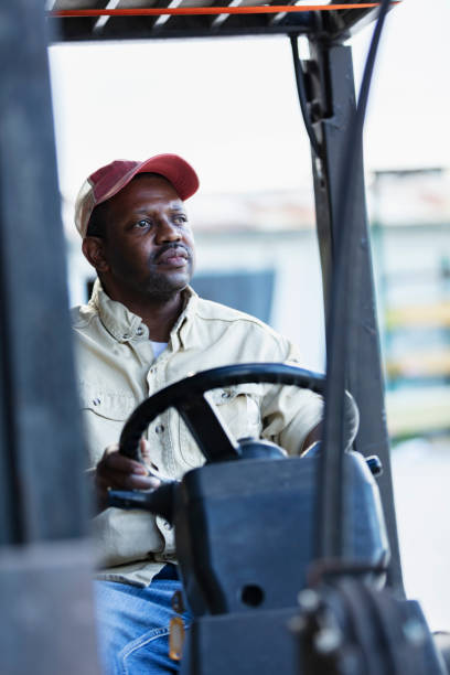 istock African-American man working at lumberyard on forklift 1397409277