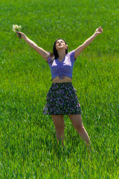 istock Happy Young Woman at Fields in Springtime 1397410364