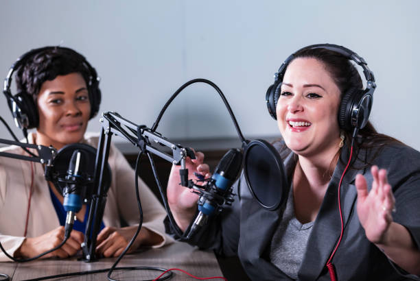 istock Two multiracial women recording a podcast 1397410431
