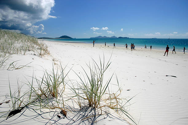 Playing on the Whiteheaven Beach stock photo