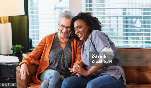 Senior woman at home with healthcare worker
