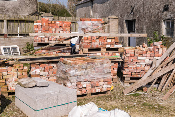 istock Pallets of reclaimed bricks sit at a building site. 1397411491