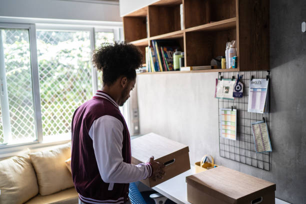 istock Young man packing belongings 1397414928