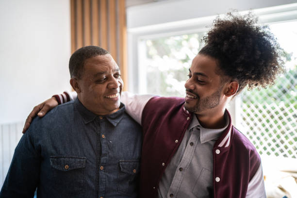 istock Father and son embracing at home 1397414974
