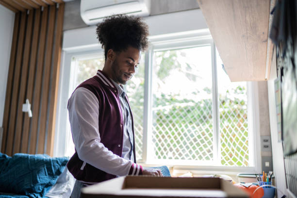 istock Young man packing belongings 1397415023