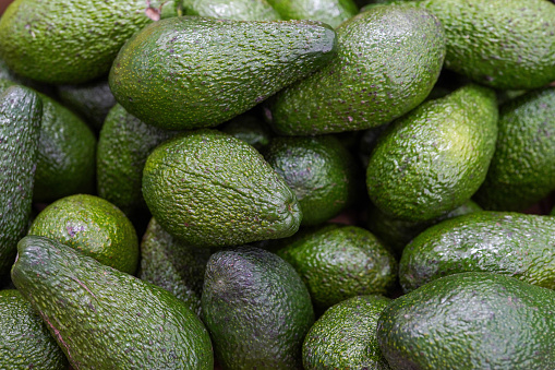 fresh avocado on the market. avocados are very nutritious and contain a wide variety of nutrients.