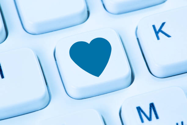 istock Online dating searching search partner love internet app heart blue computer keyboard 1397417595