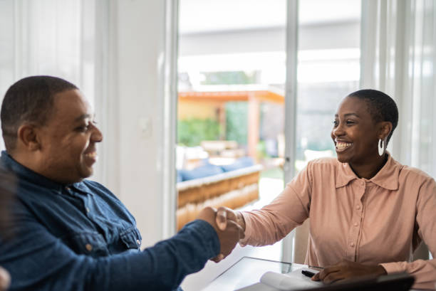 istock Professional consultant handshake with customer during a home vist 1397417733