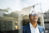 Businessman looking out of window