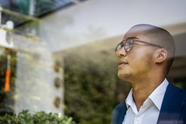 istock Businessman looking out of window 1397417793
