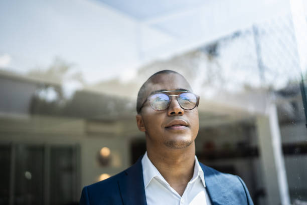 istock Businessman looking out of window 1397417801